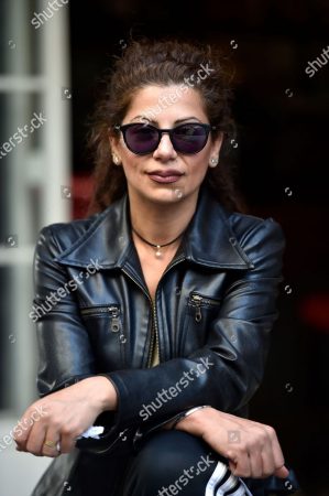 Mandatory Credit: Photo by WAEL HAMZEH/EPA-EFE/Shutterstock (10489846c) Malak Alaywe Herz, the woman who became an icon of the Lebanese uprising when she kicked a minister's bodyguard, looks on during an interview in Beirut, Lebanon, 30 November 2019 (issued 02 December 2019). A kick in between the legs of an armed bodyguard of the Lebanese Education Minister Akram Chehayeb made Herz a symbol of the rebel spirit of the uprising, which erupted on 17 October. The incident has been immortalized in the collective memory of the Lebanese and through graffiti on walls across the Middle Eastern state. Feminist icon of Lebanon's uprising, Beirut - 30 Nov 2019